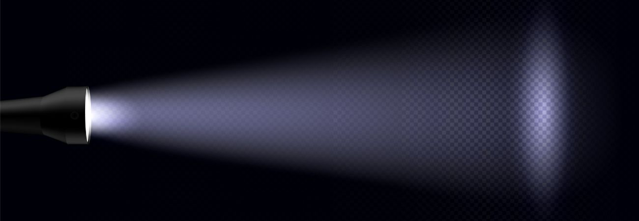 Lichtstrahl einer Taschenlampe im Dunklen